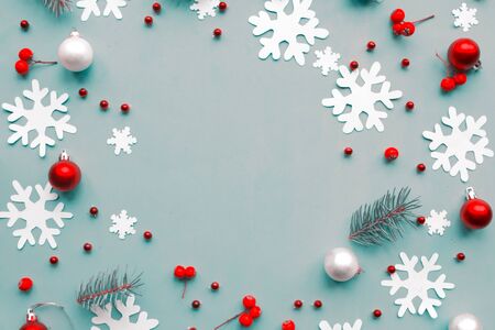 Merry Christmas and Happy New Year. Flat lay photo with Christmas decorations on blue background. Xmas greeting card, banner. Copy space for the textの写真素材