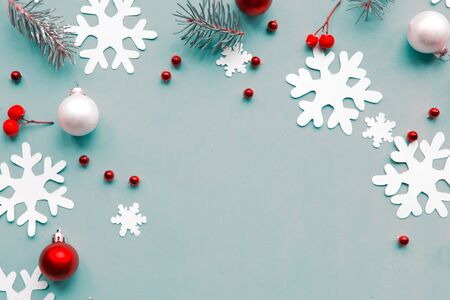 Merry Christmas and Happy New Year. Flat lay photo with Christmas decorations on blue background. Xmas greeting card, banner. Copy space for the textの写真素材