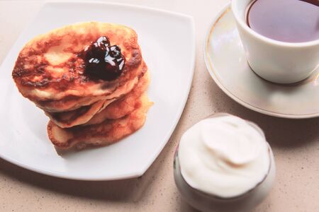 Sweet homemade pancakes stack and tea cupの写真素材