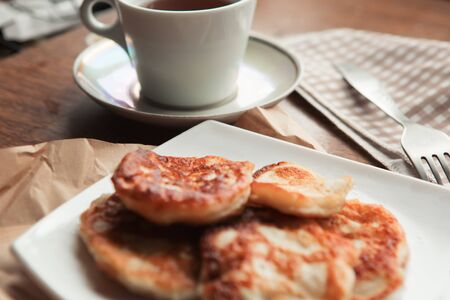Sweet homemade pancakes and tea cupの写真素材