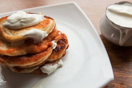 Sweet homemade pancakes with soucream, closeupの写真素材