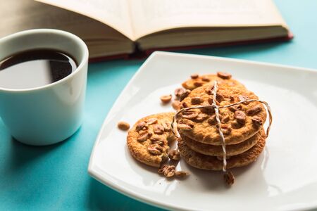 Coffee cup and cookies on the tableの写真素材