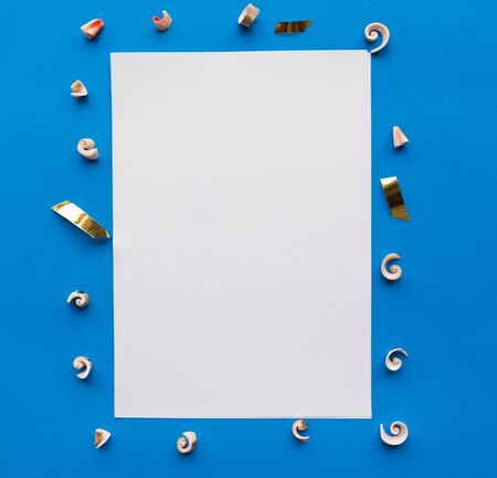White mockup blank with silver decorations on blue backgroundの写真素材