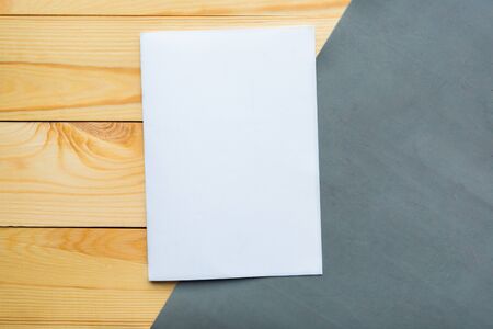 White mockup blank on wooden background, flat lay, top viewの写真素材
