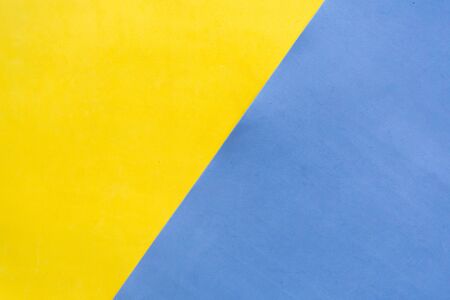 Yellow and blue geometric paper backgroundの写真素材