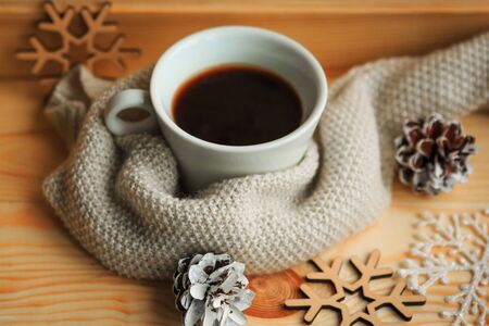 Coffee cup and Christmas decorations on wooden background. Merry Christmas and Happy new Yearの写真素材