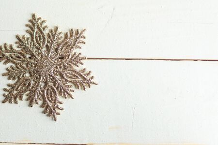 Christmas decorative snowflake on white wooden background, copy spaceの写真素材