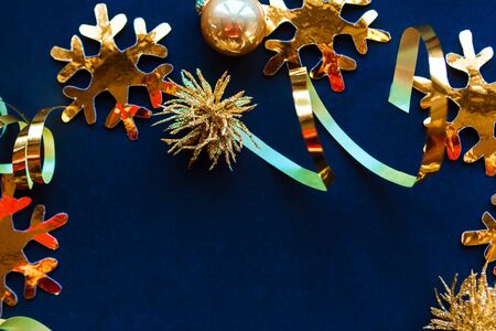 Golden decorations on black background, flat lay, top view, copy space, minimal concept. Xmas greeting card.の写真素材