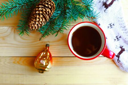 Coffee cup and Christmas decorations on wooden background. Flat lay, top view, copy spaceの写真素材