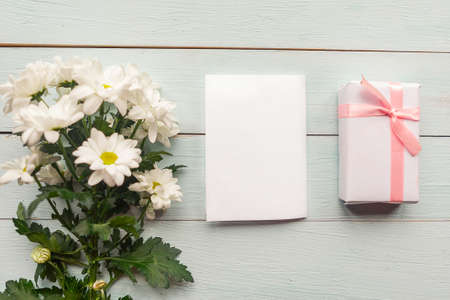 bouquet of white chrysanthemums on blue background, copy spaceの写真素材