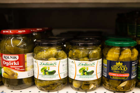 Minsk/ Belarus - March 20 2020: Pickles of cucumbers in banks on the shelves in the storeのeditorial素材