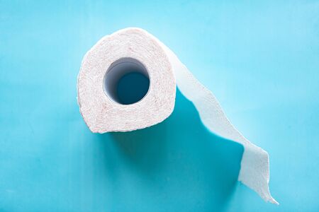 toilet paper roll on blue background. Quarantine 2020 conceptの写真素材