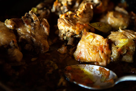 delicious homemade fried meat in a pan, closeup