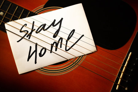 Guitar with card Stay Home. Quarantine concept