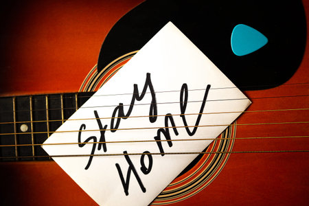 Guitar with card Stay Home. Quarantine concept