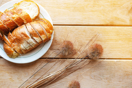 Sliced white bread on wooden background, top view