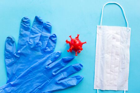 Medical gloves and mask on blue background. Covid19 concept. Coronavirus conceptの写真素材