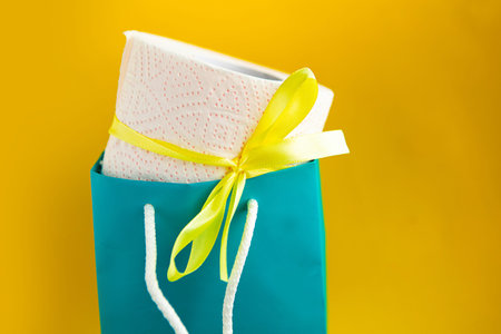 toilet paper roll with gift bow in package