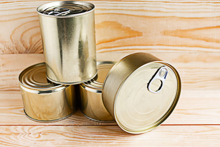 canned meat packs as a quarantine stock on wooden background