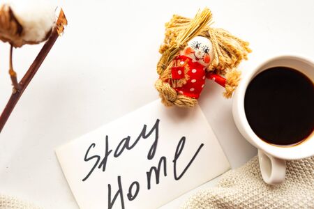 Coffee cup and card with text Stay Home, top view. Quarantine conceptの写真素材