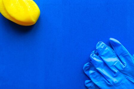 Soap bar and medical gloves on blue background. Copy space for the text. Covid-19 conceptの写真素材