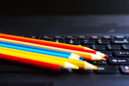 Color pencils on the keyboard. Back to school conceptの写真素材