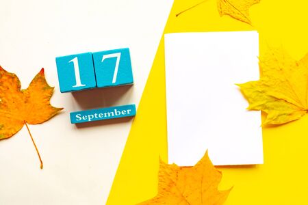 September 17, empty yellow and white geometric background. Wooden handmade calendarの写真素材