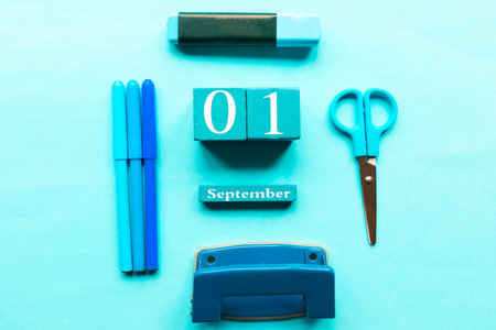 School supplies on blue background, flat lay, top view