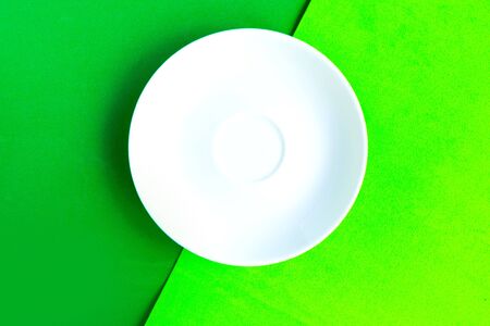 White mockup plate on green background. Copy space for the text. Minimal conceptの写真素材