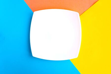 White mockup plate on color background. Copy space for the text. Minimal conceptの写真素材
