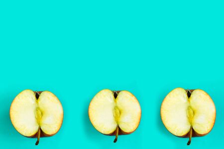 Sliced apple pattern on blue background, copy space for the text, bannerの写真素材