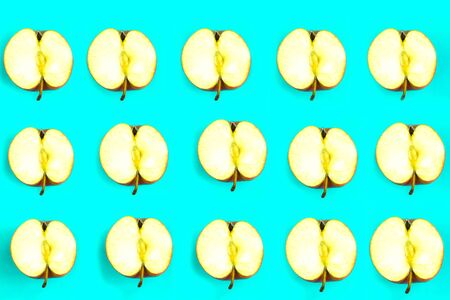 Sliced apple pattern on blue background, minimal conceptの写真素材