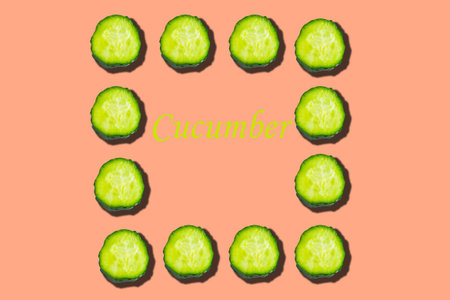 Cucumber pattern on pink background, minimal concept, copy space for the textの写真素材