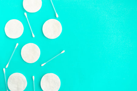 Cotton sponges and cotton buds pattern on blue background, minimal concept, copy space, banner