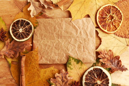 Autumn Background with Candied Oranges, Spices and Foliage. Thanksgiving Concept
