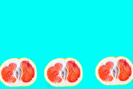 Sliced grapefruit pattern on bright blue background, minimal concept, copy space for the text, bannerの写真素材