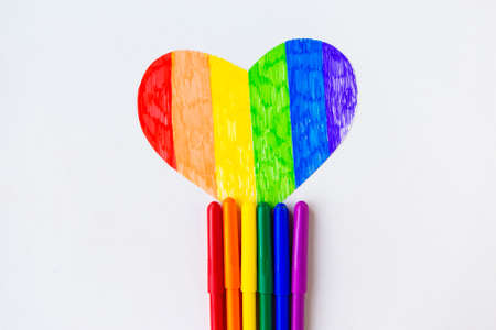 Heart in lgbtq colrs and color pencils on white background, top viewの写真素材