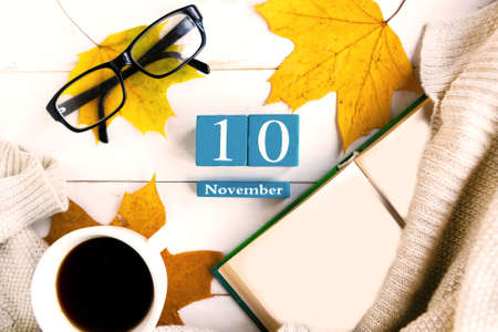 November 10th. Blue cube calendar with month and date on wooden background.の写真素材