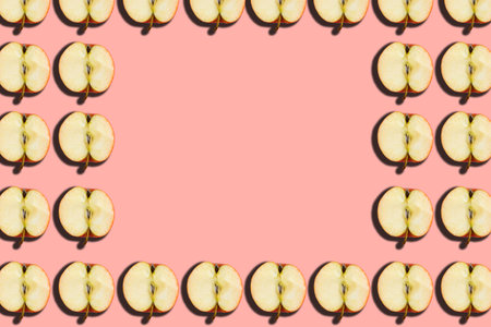 Sliced apple pattern on pink background, minimal concept, copy space, banner