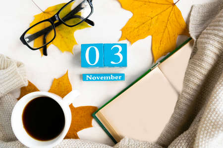 November 3. Blue cube calendar with month and date on wooden background.の写真素材