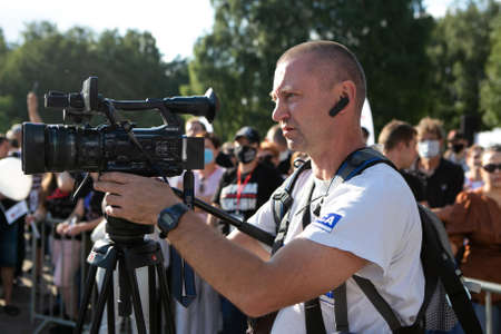 Minks / Belarus - 30 July 2020: videographer works with a camera in the parkのeditorial素材