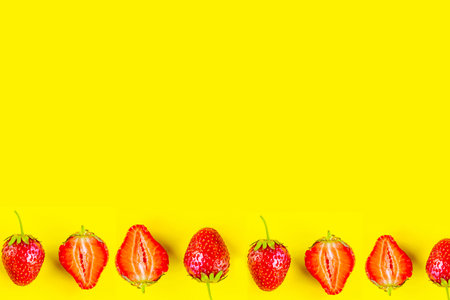 Strawberry pattern on bright yellow background, copy space for the text