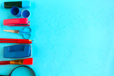 School supplies on blue background, top view. Back to school concept. Copy space for the textの写真素材