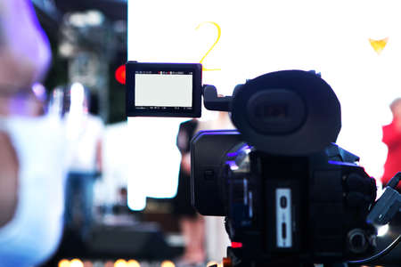 videographer in face mask shoots the event on cameraのeditorial素材