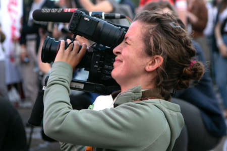 Minsk, Belarus - July 30, 2020: girl with camera works on the eventのeditorial素材