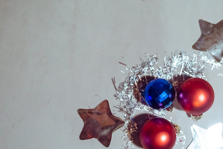 Christmas baubles on gray background, top view. Copy space for the text. Merry Christmas and Happy...