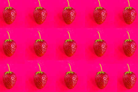 Strawberry pattern on dark red background, minimal conceptの写真素材