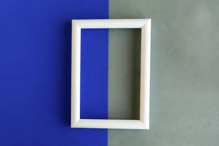 White photo frame on geometric background, copy space for the text, minimal concept, template for designerの写真素材