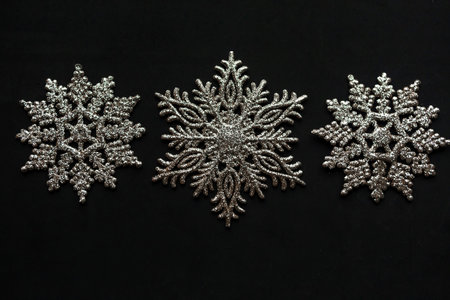 Decorative snowflakes on black background, Merry Christmas and Happy New Year