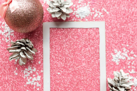 Christmas baubles and frame on pink glitter background. Merry Christmas greeting cardの写真素材